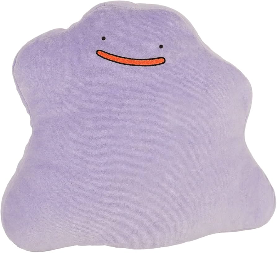 Pokemon Plush: Ditto - Soft lavender plush shaped like a blob with simple black eyes and a small orange smile.