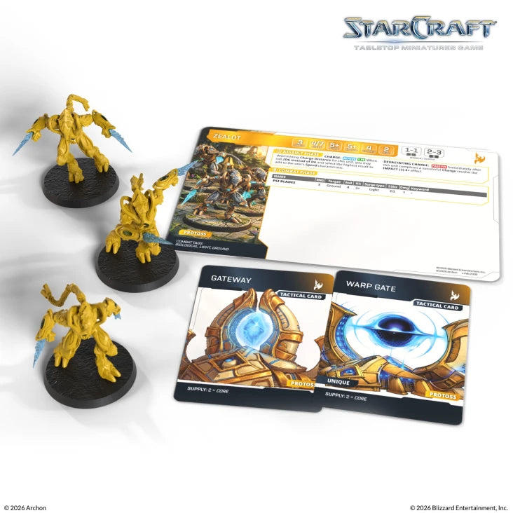 StarCraft TMG: Protoss - Zealot (PREORDER) - Four yellow Protoss Zealot miniatures with black bases, two game cards featuring blue and gold designs, and a white player.