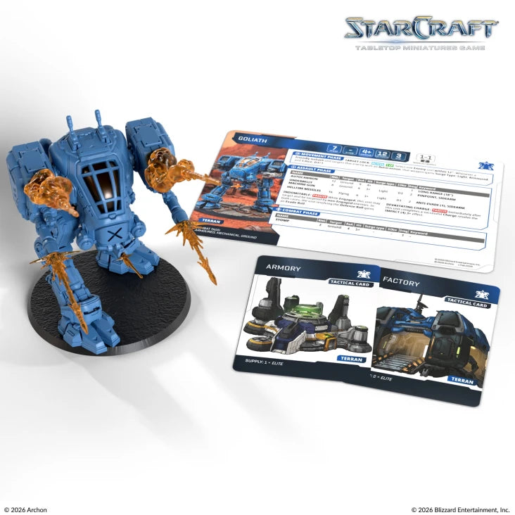 StarCraft TMG: Terran - Goliath (PREORDER) - Blue and orange mech figurine with heavy armor and weaponry, displayed with game cards on white background.