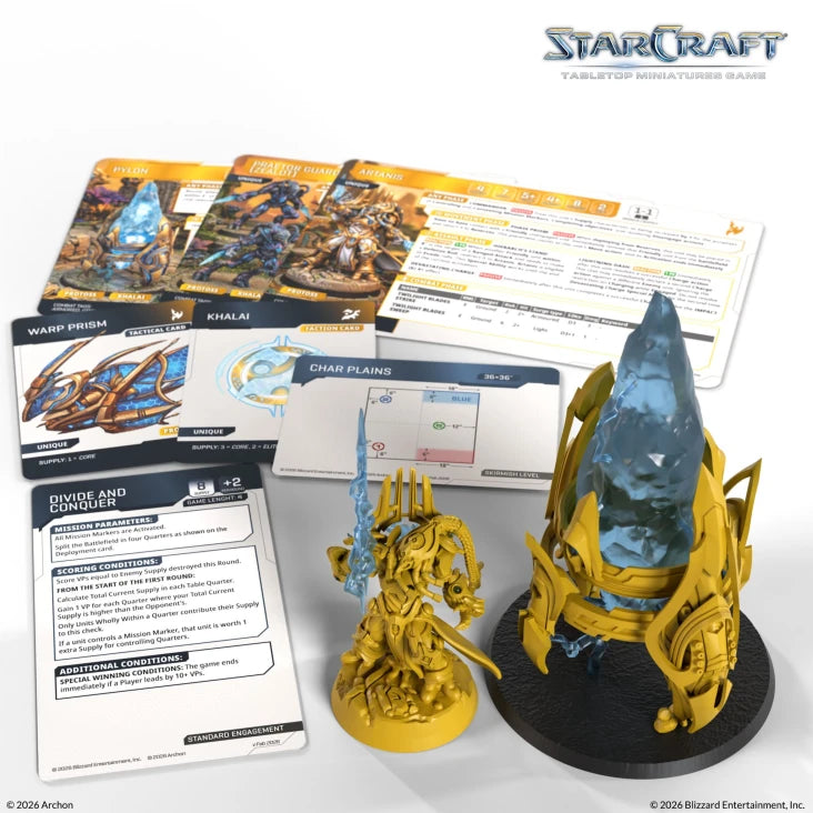 StarCraft TMG: Protoss - Artanis & Pylon (PREORDER) - Yellow resin Artanis miniature with detailed armor and energy blades, translucent blue Pylon figure on black base,.
