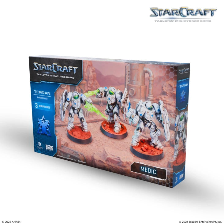 StarCraft TMG: Terran - Medic (PREORDER) - StarCraft Terran Medic miniatures set with three white armored figures on orange bases in sci-fi desert backdrop box.