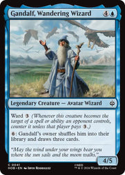 The Hobbit #41 Gandalf, Wandering Wizard - The Gathering card featuring Gandalf the wizard holding a staff in a cloudy, mountainous landscape with flying creatures in.