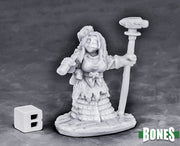 Dwarf Forge Priestess - Unpainted gray resin miniature of a female dwarf priestess holding a tall staff with a hammer top, wearing layered robes and