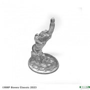 Disapproving Hand - Silver-colored skeletal hand sculpture pointing upward with index finger extended on a rounded base.