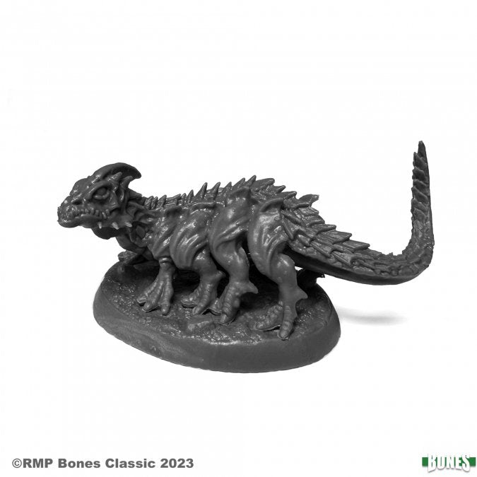 Greater Basilisk - Dark gray fantasy basilisk figurine with textured scales, four legs, spiked back, and long tail on oval base.