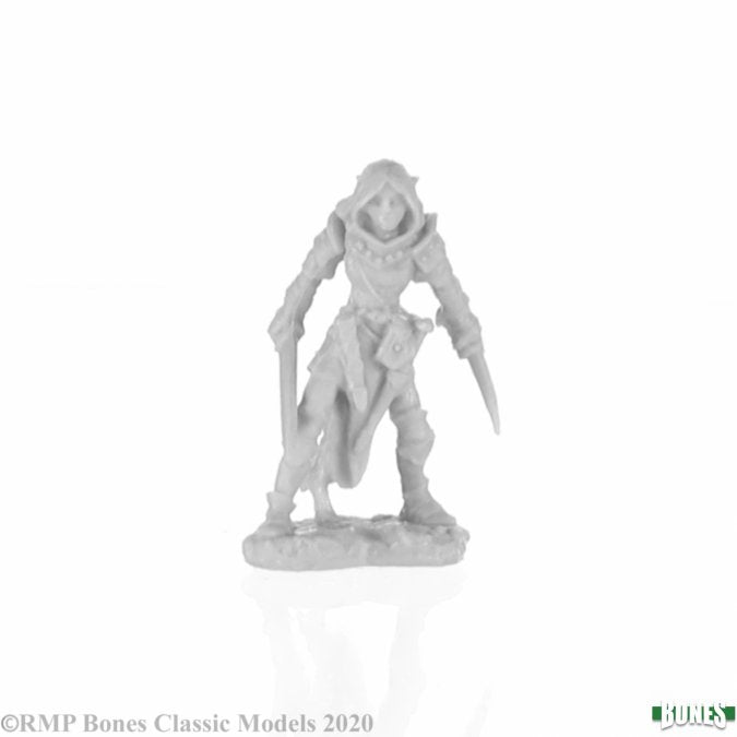 Shardis, Female Elf Rogue - Unpainted gray plastic miniature of a female elf rogue crouching with dual daggers and detailed armor.