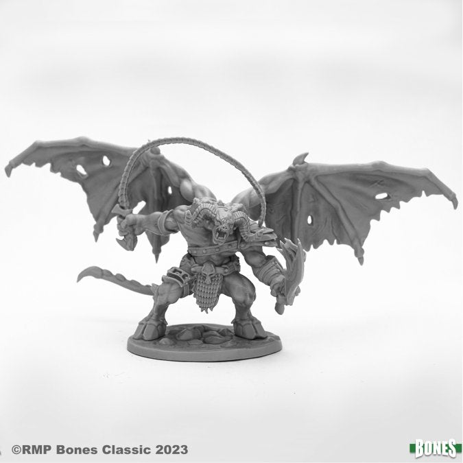 Narglauth, Fire Demon - Reaper Bones Classic Deluxe Boxed Set - Gray plastic miniature of a muscular demon with large tattered wings, horns, and a whip in one hand, standing on a round.