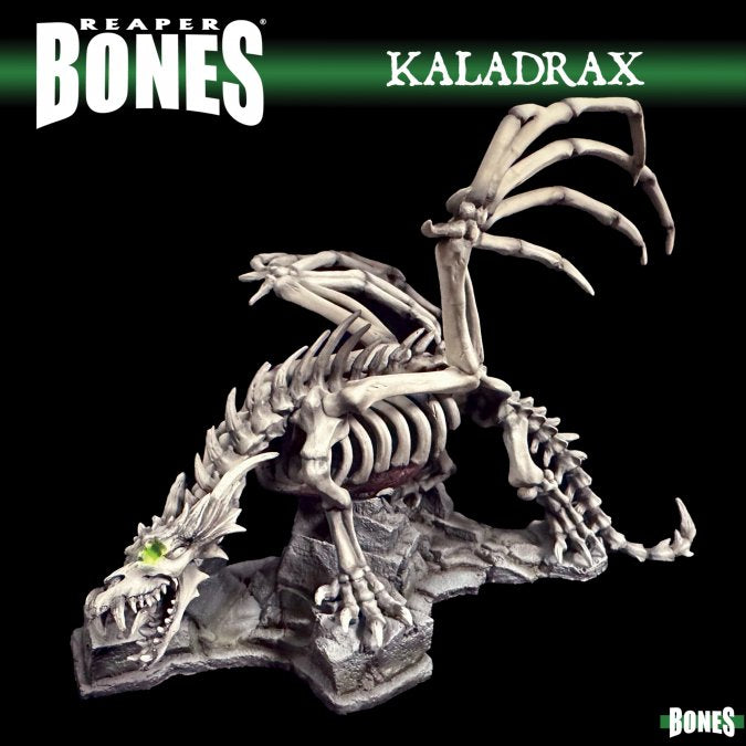 Kaladrax, Skeletal Dragon - Gray skeletal dragon miniature with large, curved wing bones and glowing green eyes, perched on rocky base.