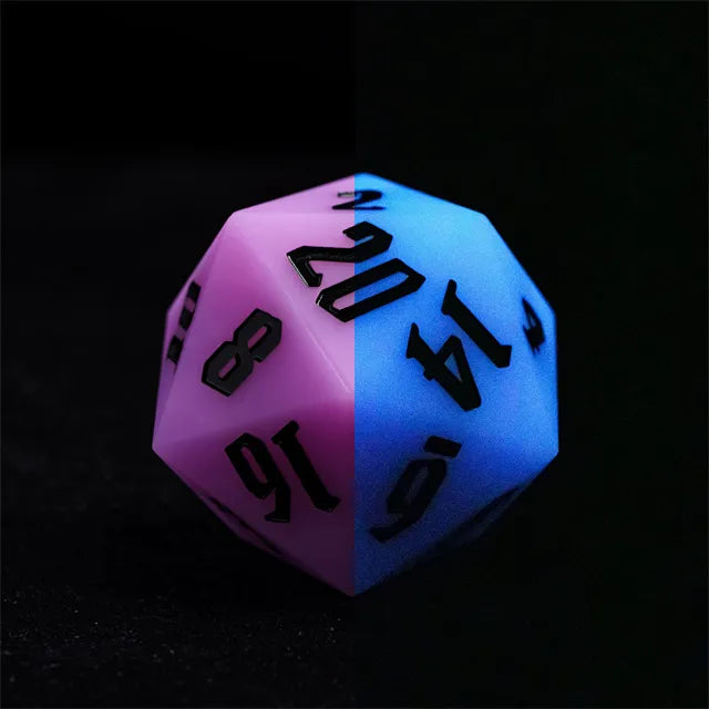Giant Bouncy D20 - Glow In The Dark Purple - Large 20-sided bouncy die glowing purple and blue with black numbers on smooth surface.