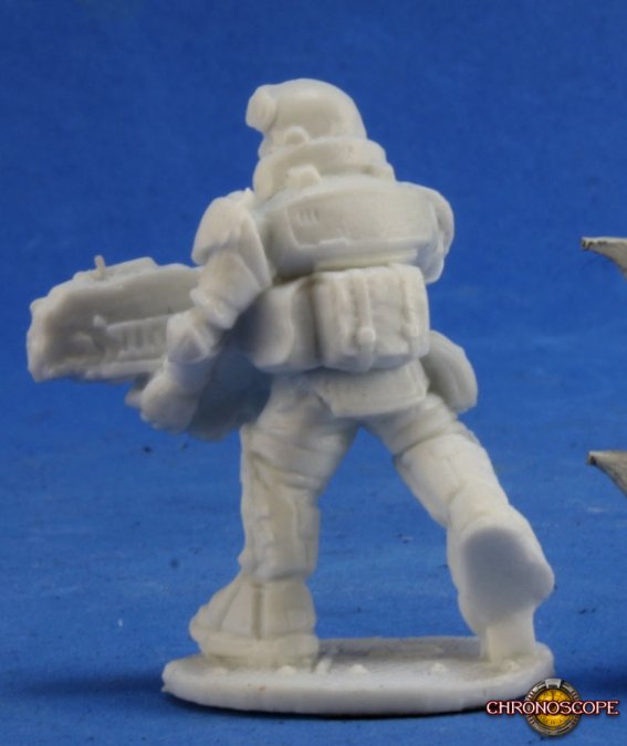 Aztec, IMEF Trooper - Unpainted miniature sci-fi trooper with bulky armor and large weapon seen from behind on round base.