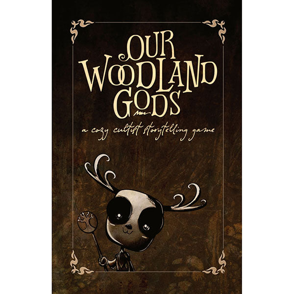 Our Woodland Gods RPG: A Cozy Cultist Storytelling Game (PREORDER) - Dark brown game box with ornate gold lettering saying Our Woodland Gods and a cute black-and-white deer-like creature.