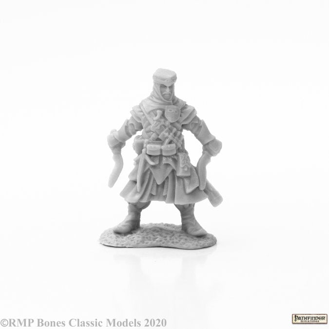 Zadim, Iconic Slayer - Gray plastic miniature figure of a medieval warrior holding two curved daggers, wearing layered armor and a cloak.