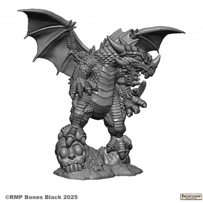 Pathfinder Red Dragon (Chibi) - Gray resin chibi dragon miniature with large wings, detailed scales, and clawed feet standing on skulls base.