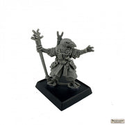 Korakai, Iconic Oracle - Gray detailed miniature figurine of a robed, beaked mask-wearing character holding a staff, standing on a black square base.