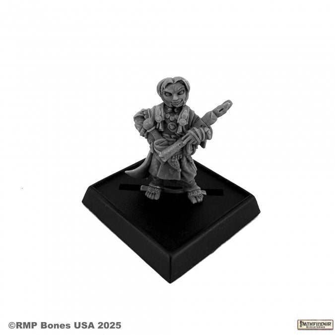 Lem, Iconic Halfling Bard - Gray plastic miniature of a halfling bard holding a flute, standing on a black square base.