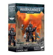 Warhammer 40,000 - Iron Hands - Caanok Var - Warhammer 40,000 Iron Hands Caanok Var miniature box showing black armored warrior with mechanical arm and weapon against.