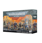 Warhammer 40,000 - Space Marines - Captain Titus and The Wardens of Ultramar - Boxed set of seven detailed Space Marines miniatures with blue armor and gold accents, featuring Captain Titus and banner.