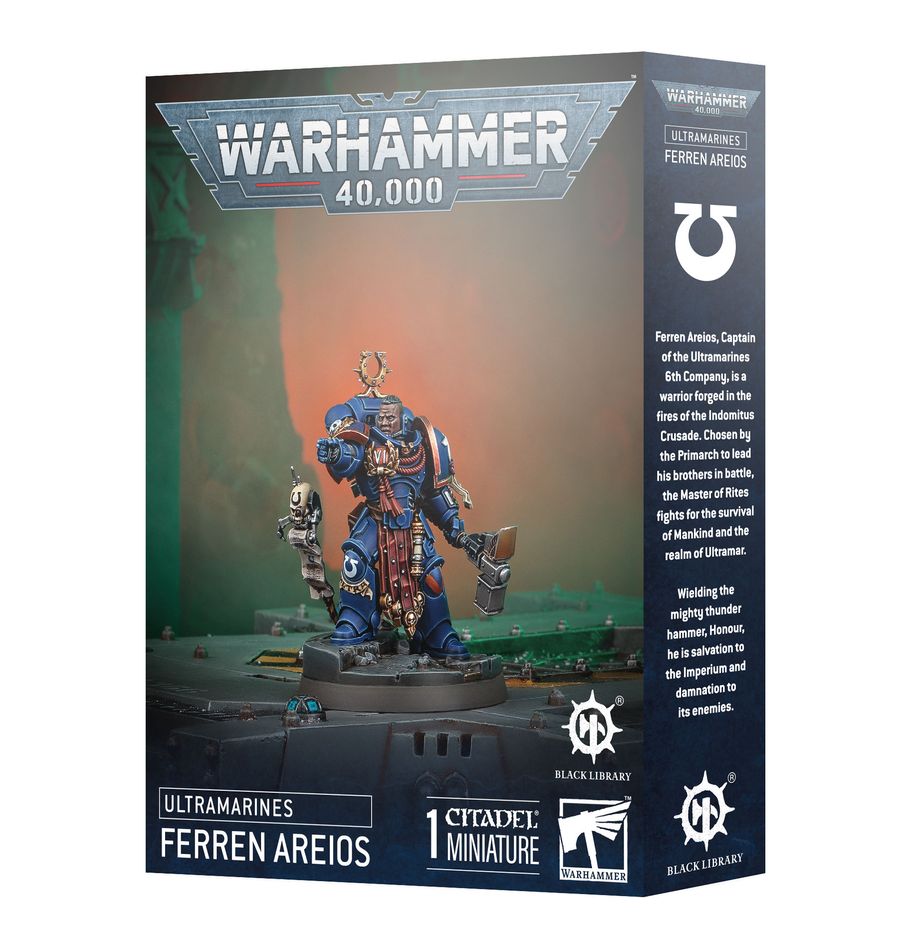 Warhammer 40,000 - Ultramarines - Ferren Areios - Blue armored Ultramarines Space Marine miniature holding a large rifle and knife with gold and silver details on display.