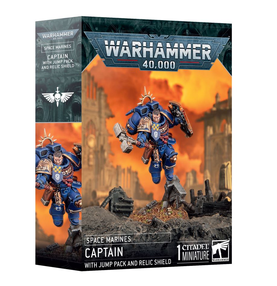 Warhammer 40,000 - Space Marines - Captain with Jump Pack and Relic Shield - Warhammer 40,000 Space Marine Captain miniature with blue armor, jump pack wings, and relic shield on war-torn terrain base.
