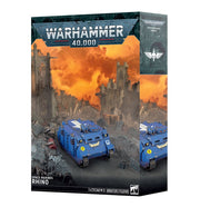 Warhammer 40,000 - Space Marines - Rhino (PREORDER) - Blue armored futuristic tank model with heavy treads and Space Marine insignia on Warhammer 40,000 box.