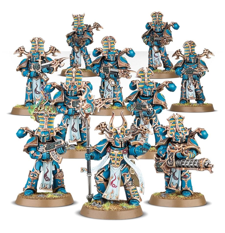 Warhammer 40,000 - Thousand Sons - Rubric Marines - Ten detailed Thousand Sons Rubric Marines miniatures in blue and gold power armor with ornate helmets and weapons on.
