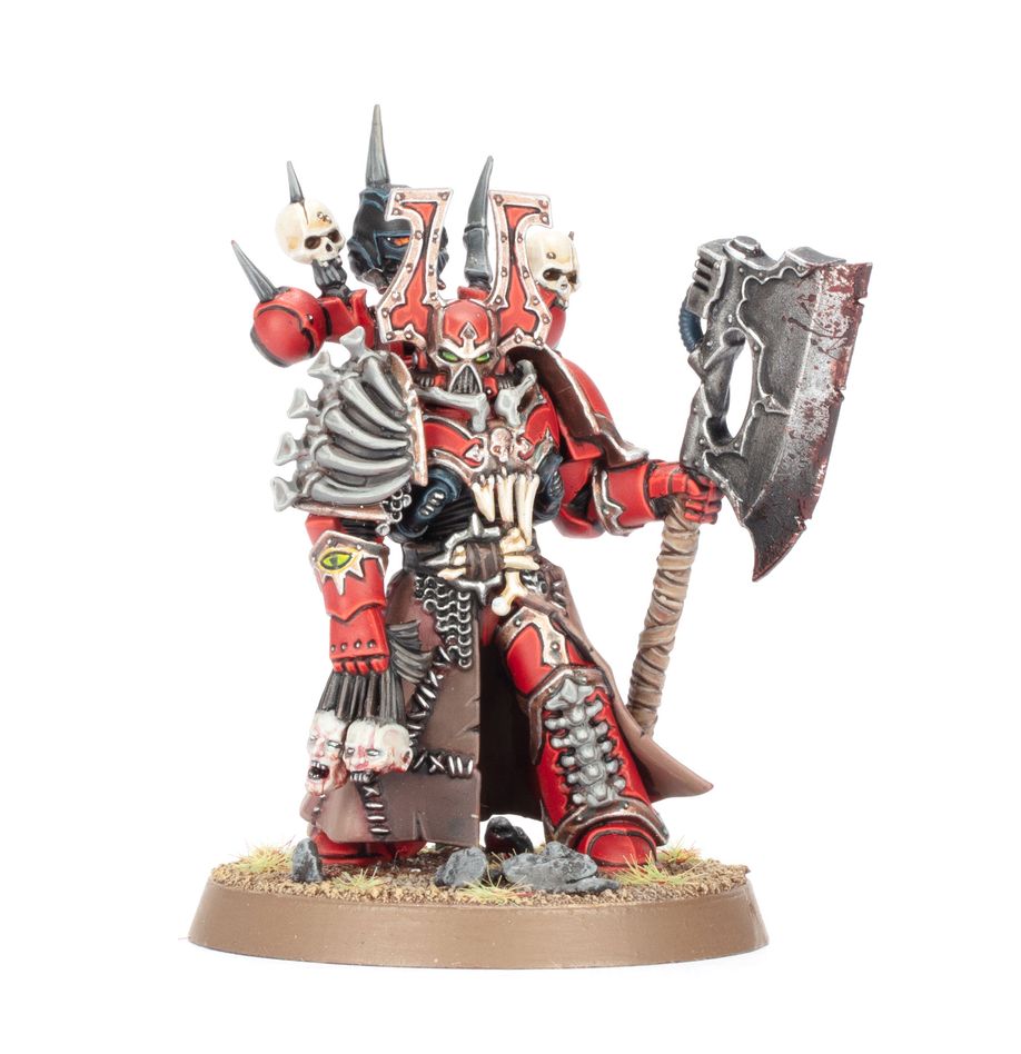 Warhammer 40,000 - World Eaters - Combat Patrol - Red and silver armored Warhammer 40K World Eaters miniature with large axe and skull motifs.