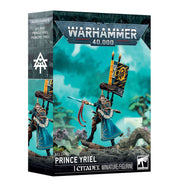 Warhammer 40,000 - Aeldari - Prince Yriel (PREORDER) - Warhammer 40,000 Prince Yriel miniature figure with blue cloak, ornate black and gold armor, and a tall banner on a rocky.