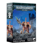 Warhammer 40,000 - Adeptus Custodes - Shield-Captain - Warhammer 40,000 Adeptus Custodes Shield-Captain miniature with gold armor and ornate green weapon on rocky terrain.
