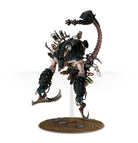 Warhammer 40,000 - Drukhari - Combat Patrol - Black and bronze insectoid Drukhari miniature with scorpion tail and clawed limbs on textured base.