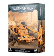 Warhammer 40,000 - T'au Empire - Hammerhead Gunship - Tau Empire Hammerhead Gunship model in orange camouflage with dual railguns and sleek futuristic design on desert.