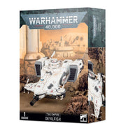 Warhammer 40,000 - T'au Empire - Devilfish - White futuristic armored vehicle model with angular design, twin side thrusters, and turret cannon on Warhammer 40k box.