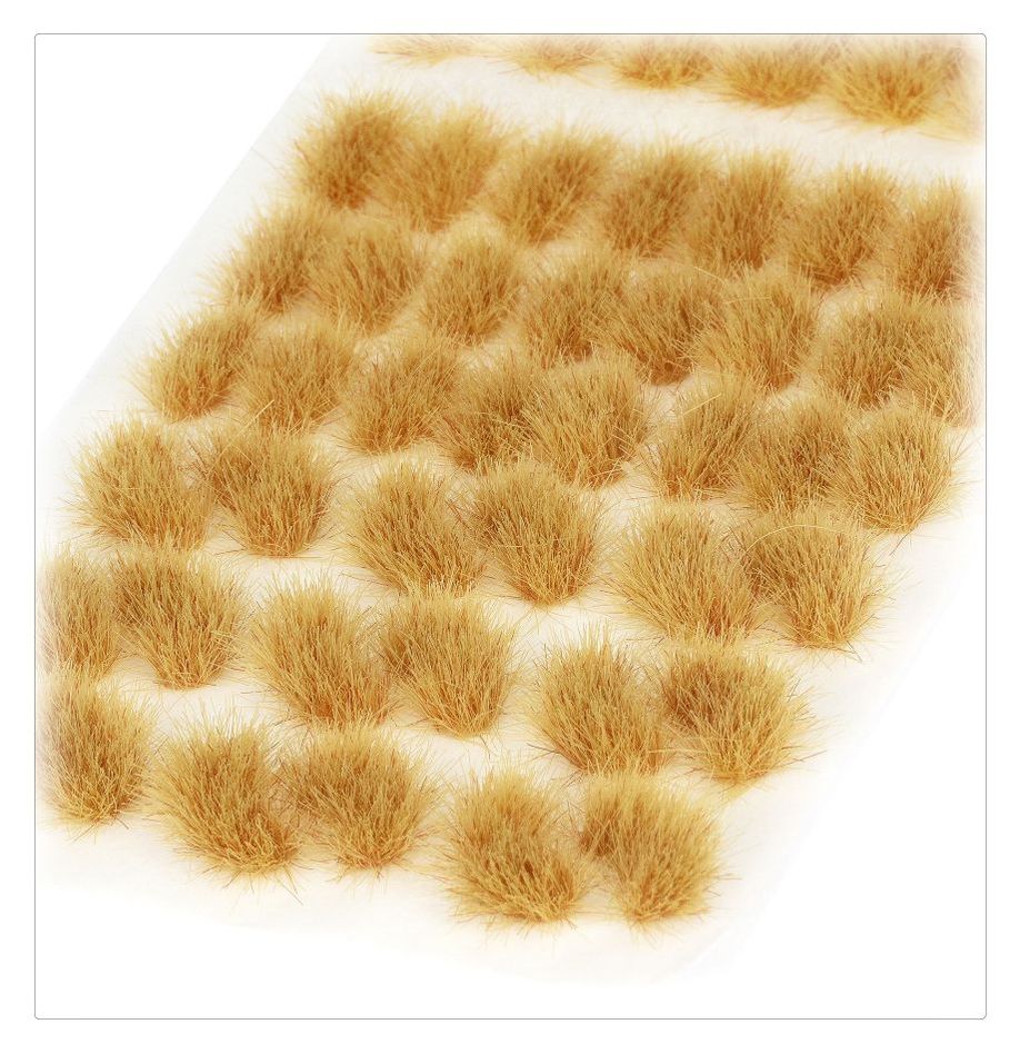 Citadel Colour - Tufts - Mordian Corpsegrass - Clusters of short, light brown synthetic grass tufts arranged neatly on a white backing sheet.