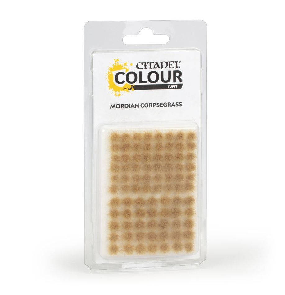 Citadel Colour - Tufts - Mordian Corpsegrass - Pack of small pale tan synthetic grass tufts arranged in a grid on clear plastic backing in blister pack.