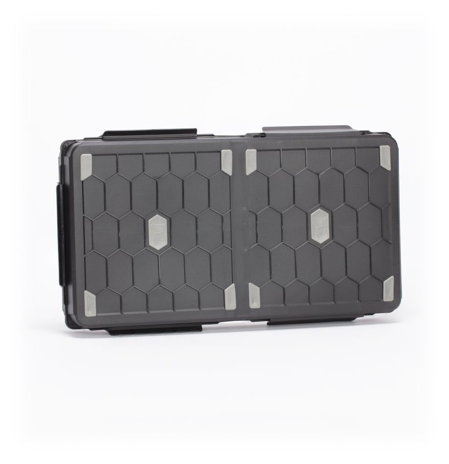 Strormvault Combat Figure Case - Compact black storage case with hexagonal pattern, reinforced corners, and secure latch closure.