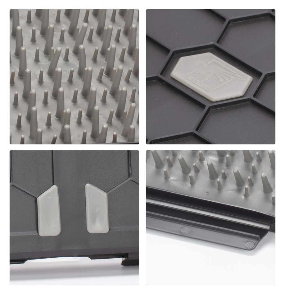 Strormvault Combat Figure Case - Black hard plastic combat figure case with hexagonal pattern and dense gray foam spikes for secure miniature storage.
