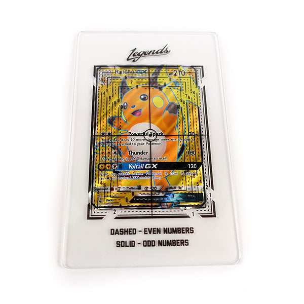 Legends Card Grading Tool - Clear rectangular plastic grading tool with black measurement lines, text, and a Legends logo on top over a colorful card.