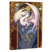 D&D 5E: Draconis: Deep in the Valley (PREORDER) - Hardcover book with a white dragon illustration on a blue and gold ornate cover titled Deep in the Valley.