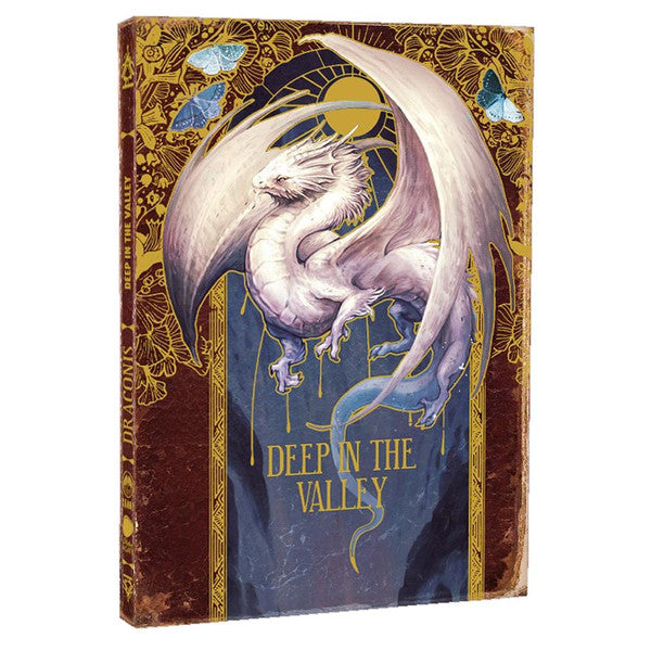 D&D 5E: Draconis: Deep in the Valley (PREORDER) - Hardcover book with a white dragon illustration on a blue and gold ornate cover titled Deep in the Valley.