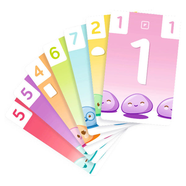 Happy Mochi (Eco Blister) - Colorful playing cards fanned out, numbered 1 to 7 with cute mochi character illustrations on each card.
