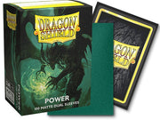 Dragon Shield 100ct Box - Dual Matte Power - Box of Dragon Shield 100 matte green card sleeves with a dragon illustration and black-backed sleeved card nearby.