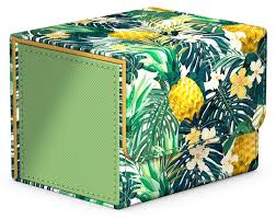 Ultimate Guard Sidewinder 100+ Deck Box - Floral Places II - Rectangular deck box with tropical floral and pineapple print, green fabric panel on side, padded material.