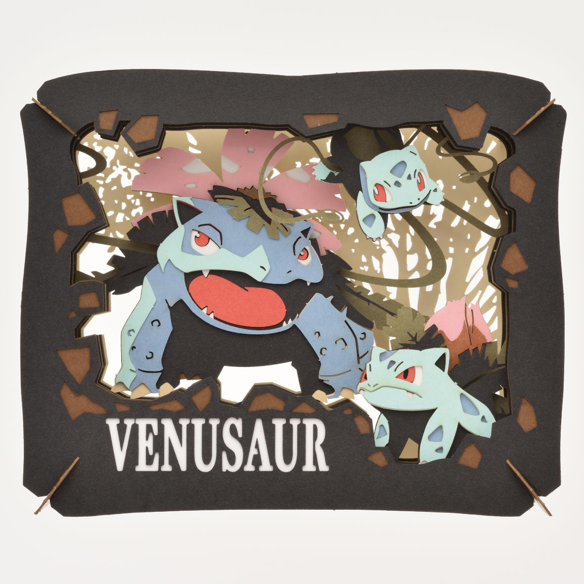 Ensky Pokémon Paper Theatre - Venusaur (PREORDER) - Three-layered paper diorama with blue-green Venusaur characters against a pink and white botanical background, framed by.
