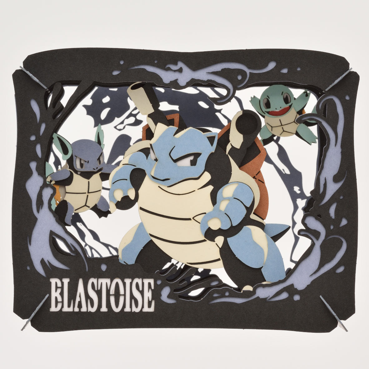 Ensky Pokémon Paper Theatre - Blastoise - Black layered paper diorama featuring blue Blastoise and two smaller Squirtle characters surrounded by water splash effects.