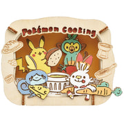 Ensky Pokémon Paper Theatre - Pokémon Cooking (PREORDER) - Colorful paper diorama featuring Pikachu, Grookey, Sobble, and Scorbunny cooking with kitchen tools and ingredients.