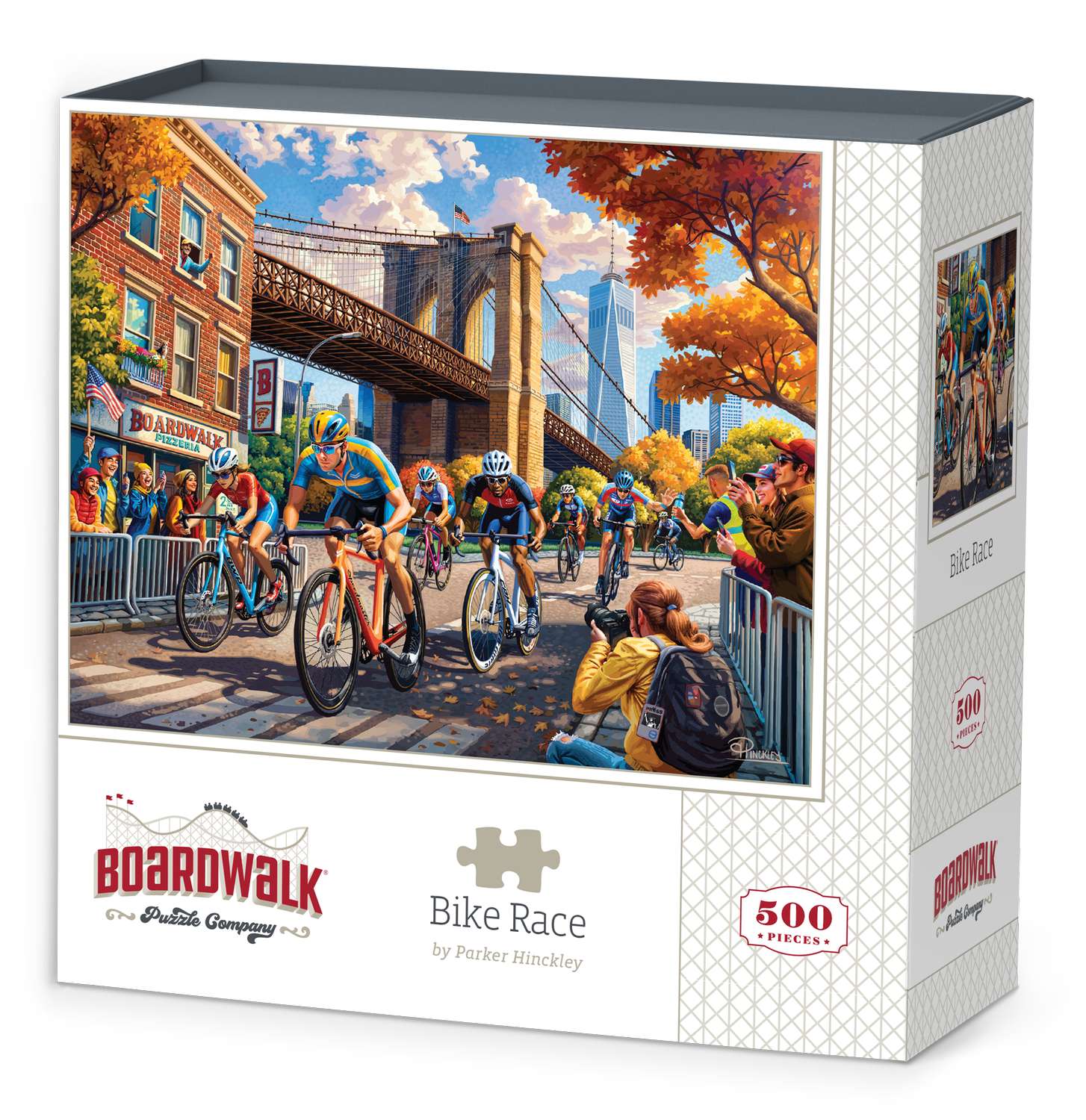 Boardwalk 500 Piece Puzzle: Bike Race - 500-piece jigsaw puzzle featuring colorful bike race scene near Brooklyn Bridge with autumn trees and city buildings.