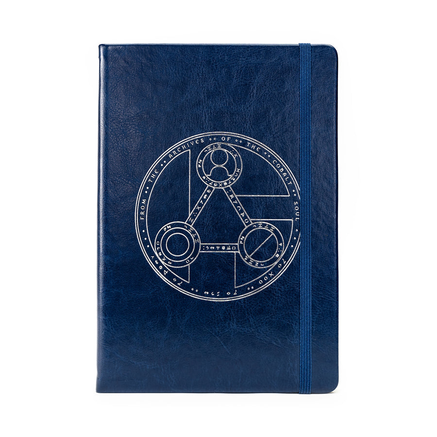 Critical Role Mighty Nein Cobalt Journal - Cobalt blue hardcover journal with silver geometric emblem and elastic band closure.