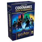 Codenames: Back to Hogwarts (PREORDER) - Rectangular dark blue board game box with silhouettes of four Hogwarts students casting spells, Hogwarts castle in the.