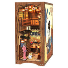 Under the Sakura Tree Book Nook (PREORDER) - Wooden book nook diorama of a Japanese street scene under cherry blossoms with lanterns and a woman in a pink kimono with a.