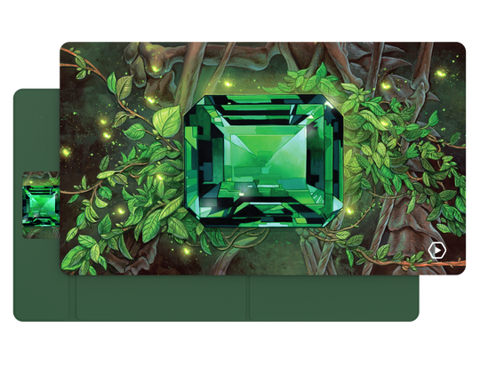 Heavy Play ETB Playmat: Art Masters Series - Emerald - Playmat featuring a large emerald-cut green gemstone surrounded by glowing green foliage on a dark forest background.