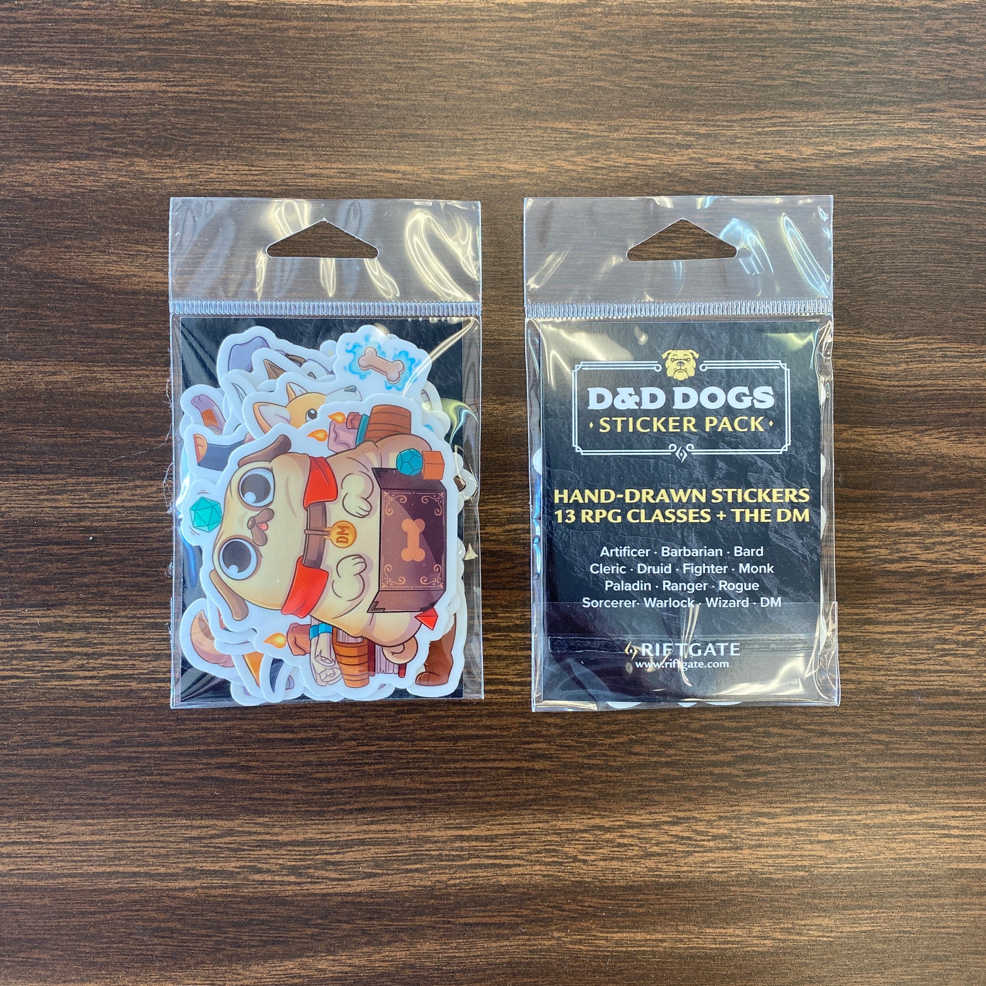 D&D Dogs Sticker Pack - Small vinyl sticker pack with colorful hand-drawn dog illustrations in D&D character costumes in a clear resealable bag.